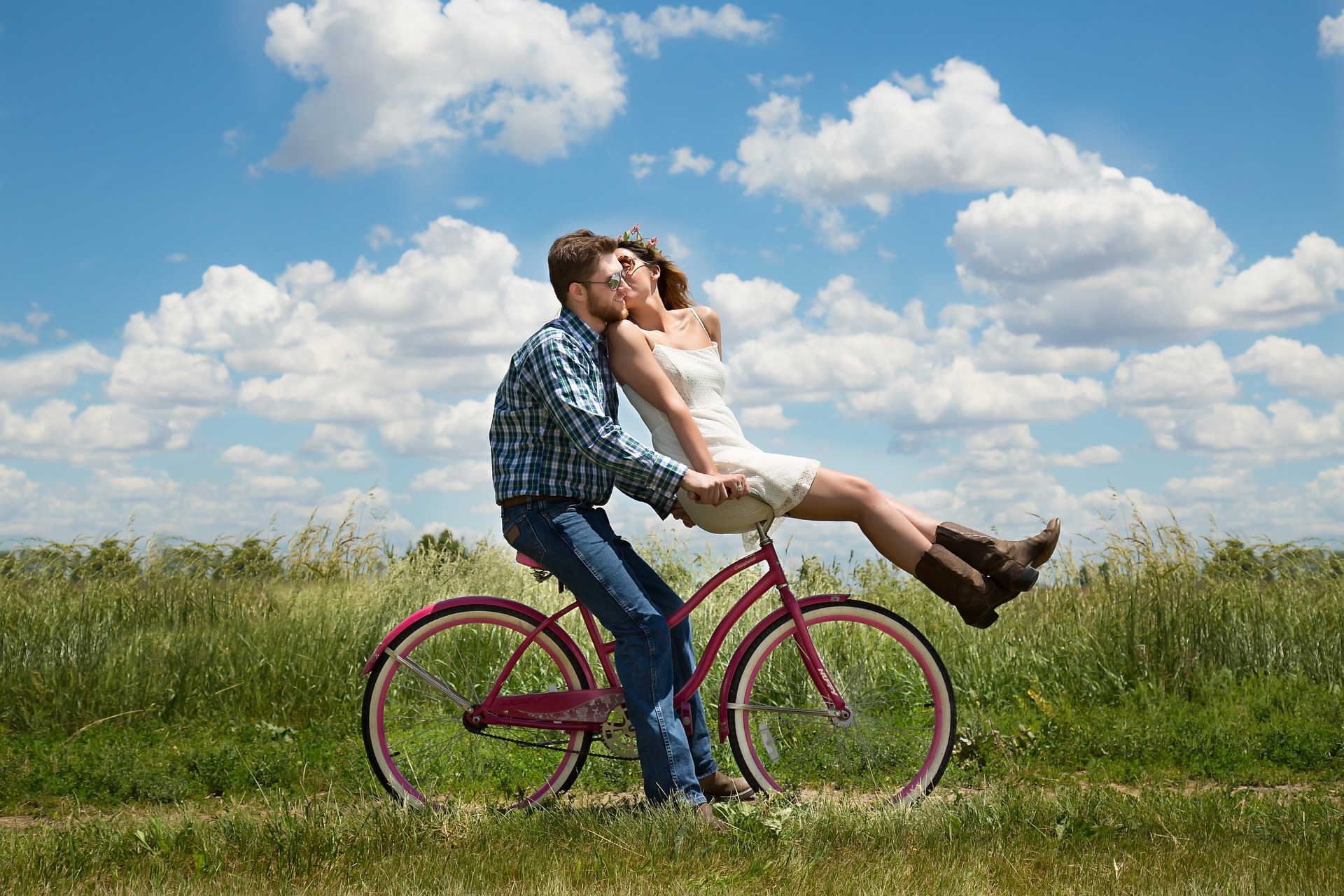 Man and Women Kissing on a Bicycle
