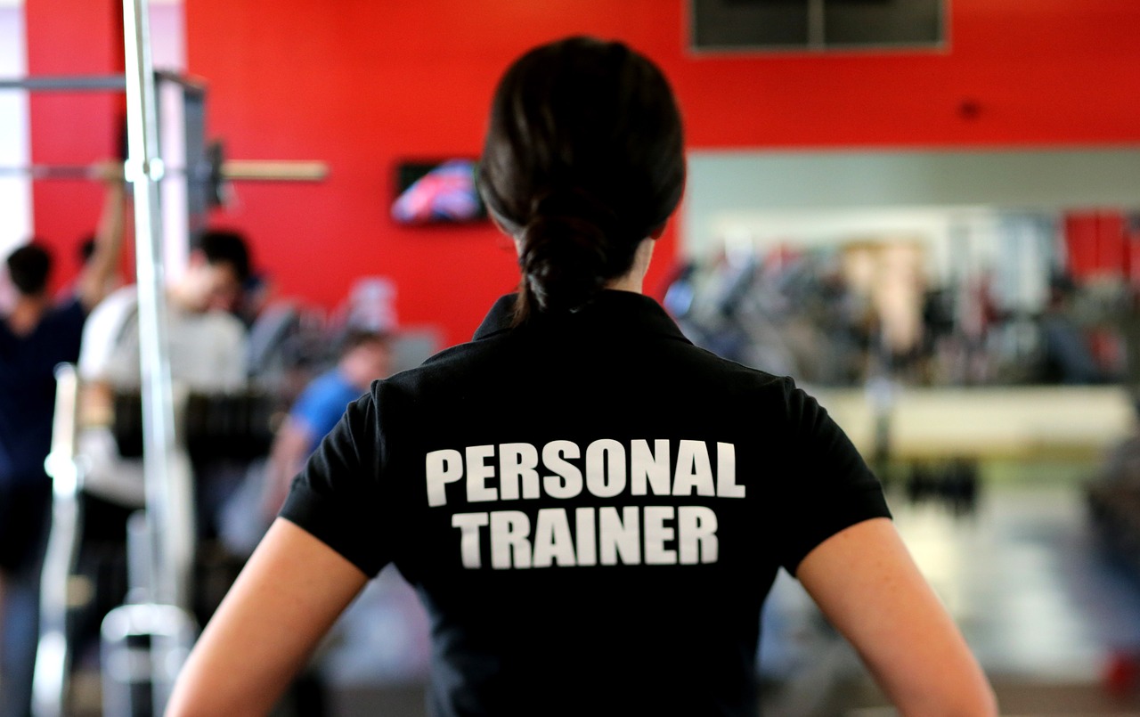 Women with a shirt that reads 'Personal Trainer'