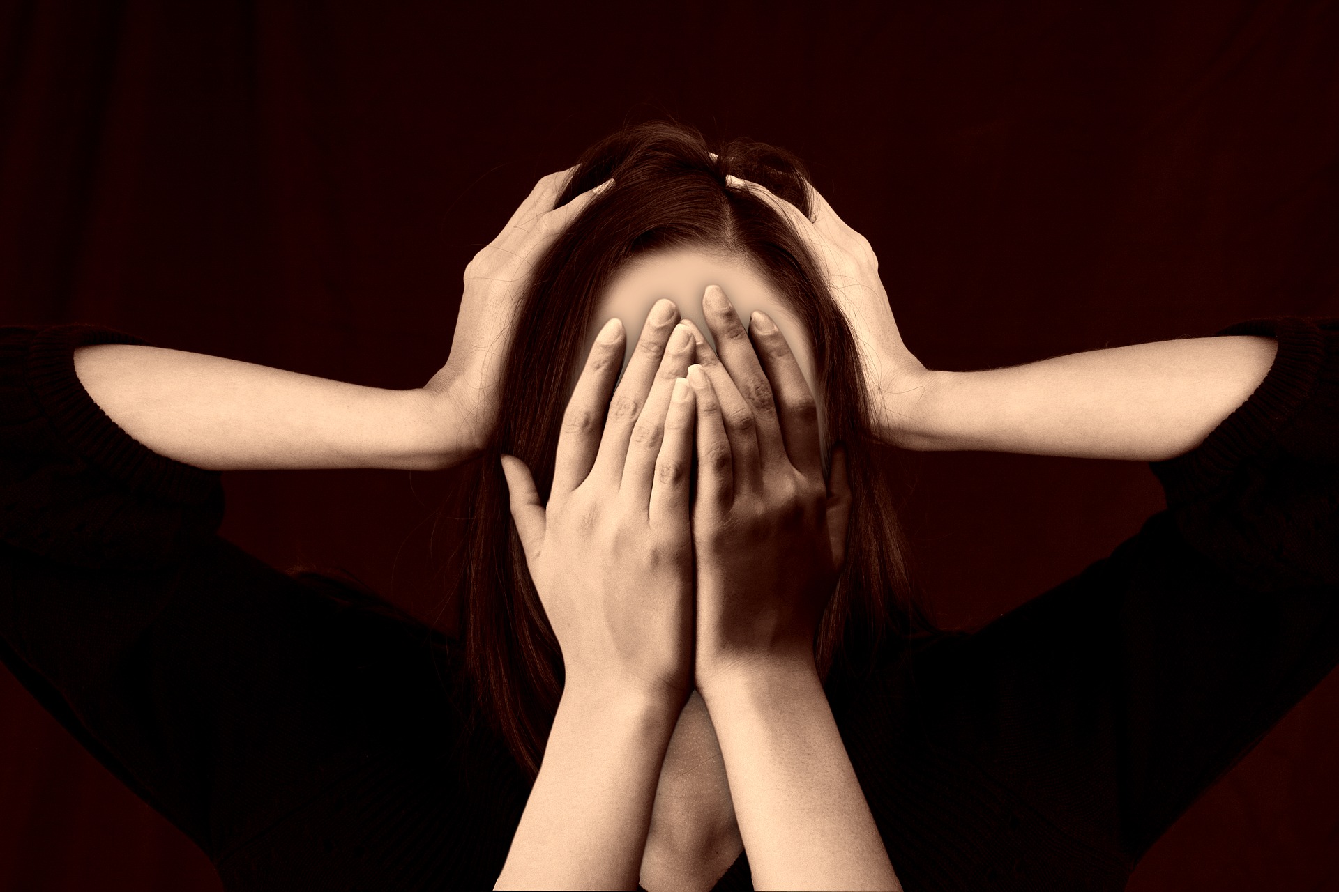 Scary Image of Women Head and Hands Holding Her Face