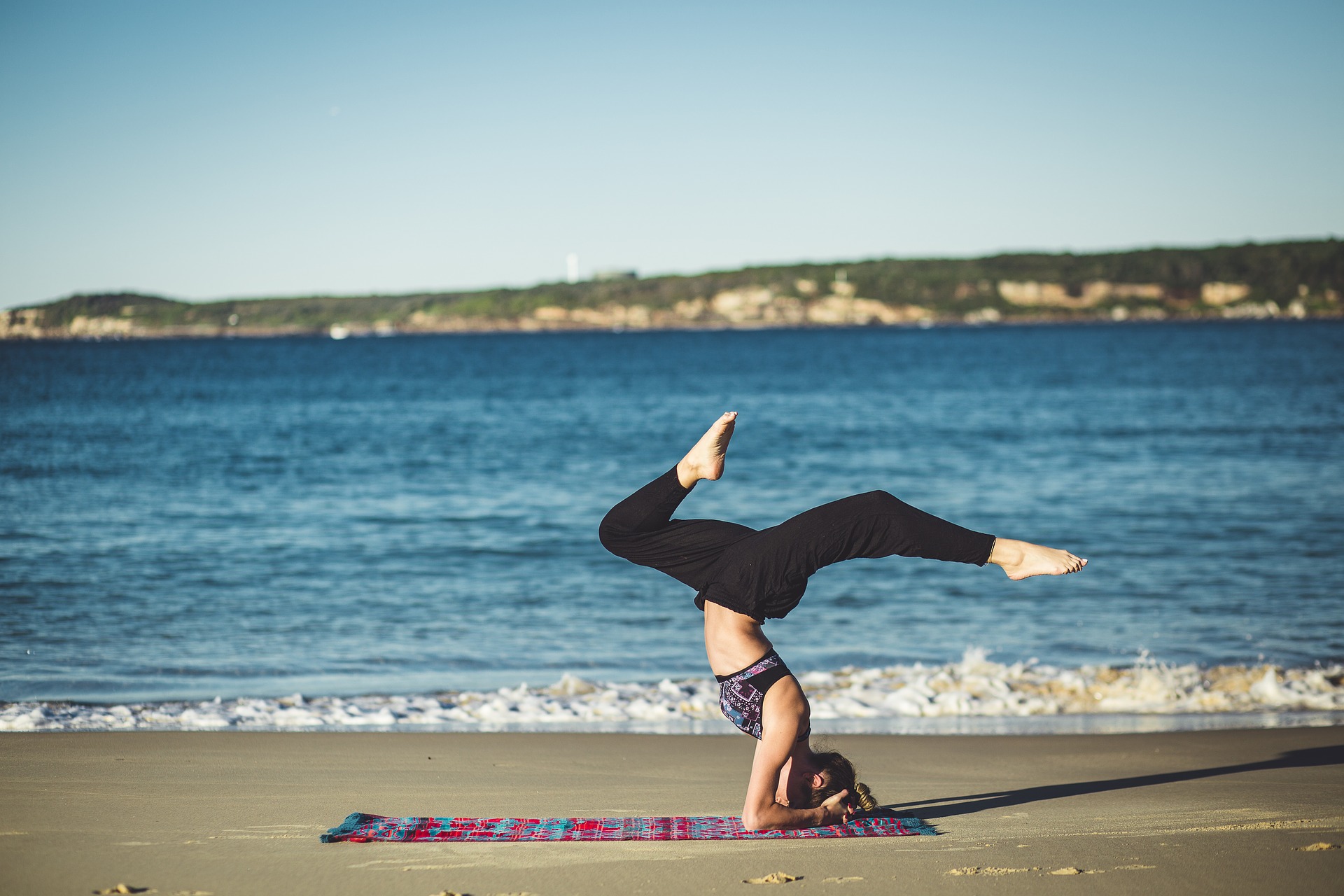 Women doing Yoga on the Beach
